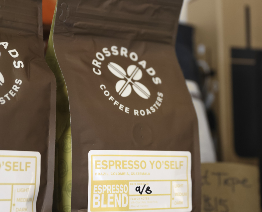 Bags of Espresso Yo’self whole bean coffee from Crossroads Coffee Roasters